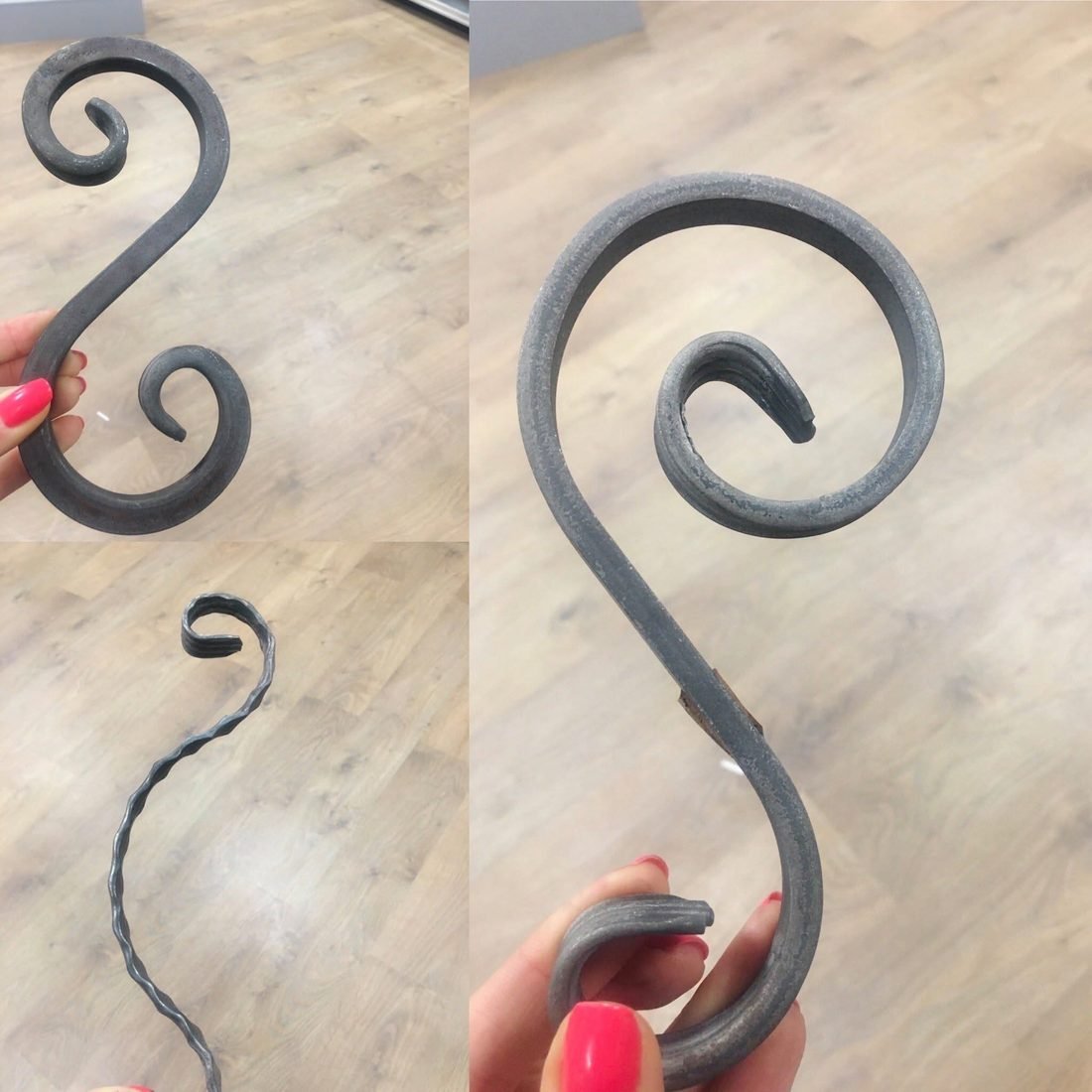 Volutas de forja sostenidas en la mano